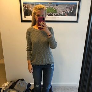 Grey sweater with open, lacey back